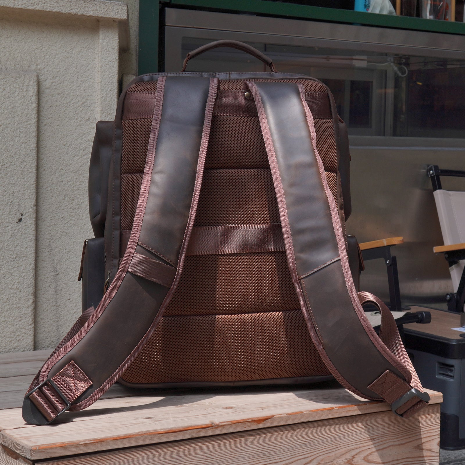 Leather backpack with outlet luggage strap